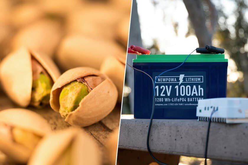 Cáscaras de pistacho apiladas junto a una batería de laboratorio