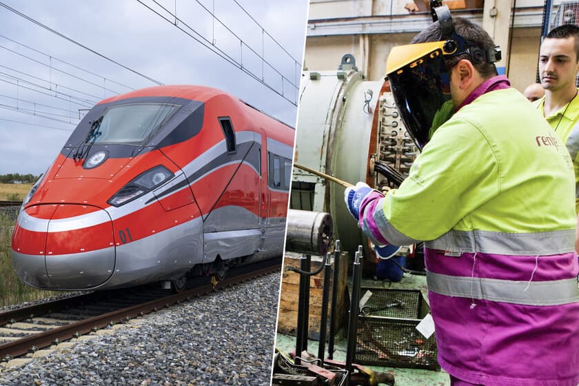 Trenes de alta velocidad en un taller de mantenimiento, con operarios trabajando en las vías.