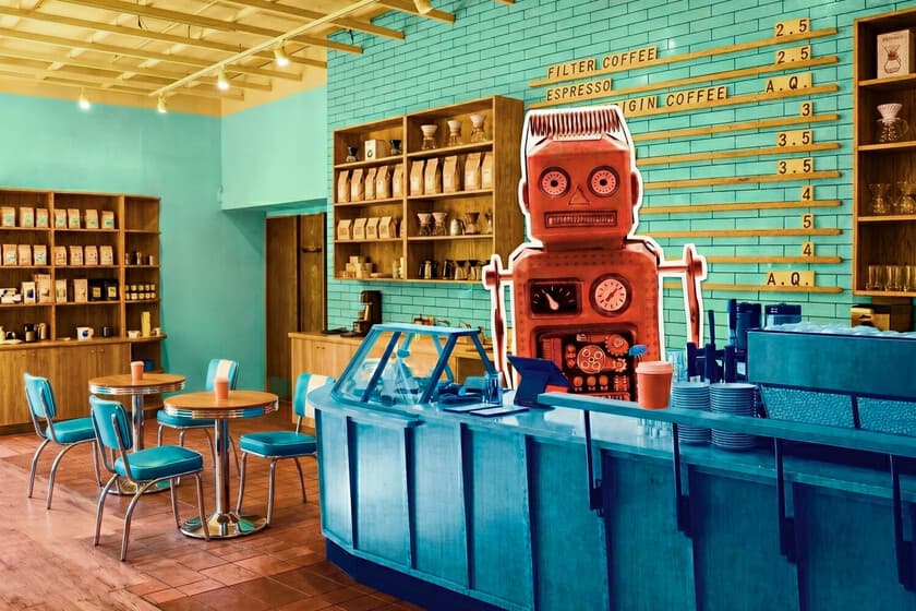 Cafetería moderna con robots y humanos trabajando, ambiente tecnológico