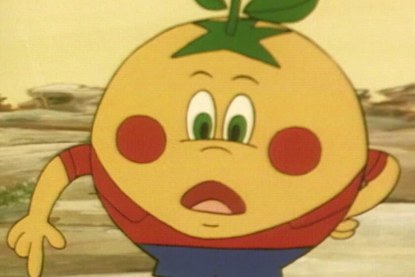 Fotograma del anime de Naranjito de 1982, con el personaje naranja sonriente y fondo deportivo
