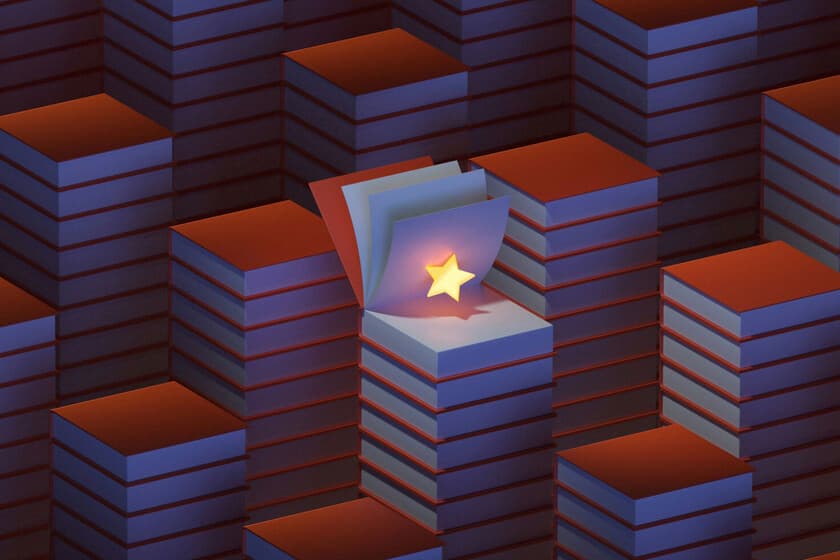 Montón de libros apilados junto a un teléfono mostrando una reseña en video