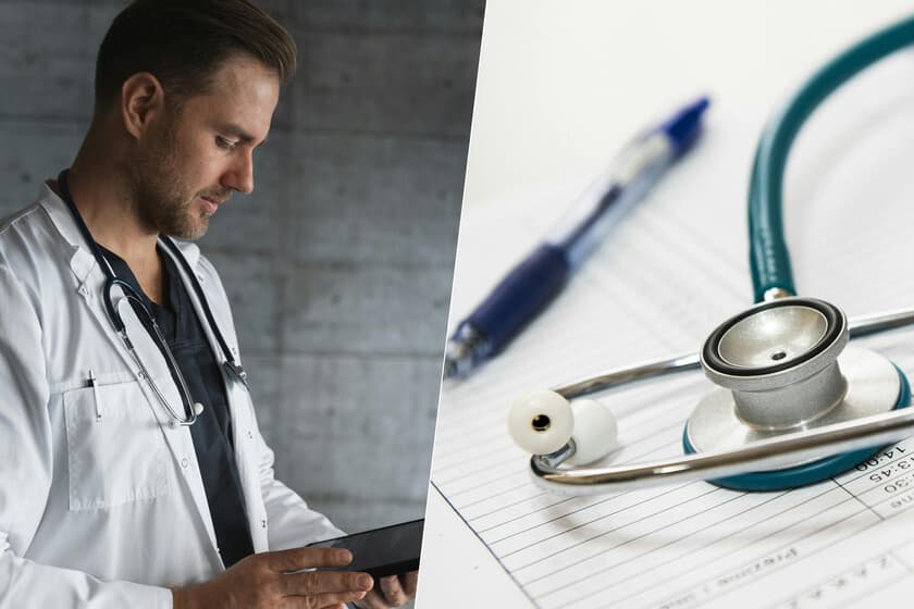 Médico escribiendo en un bloc de notas con lápiz, junto a una computadora apagada